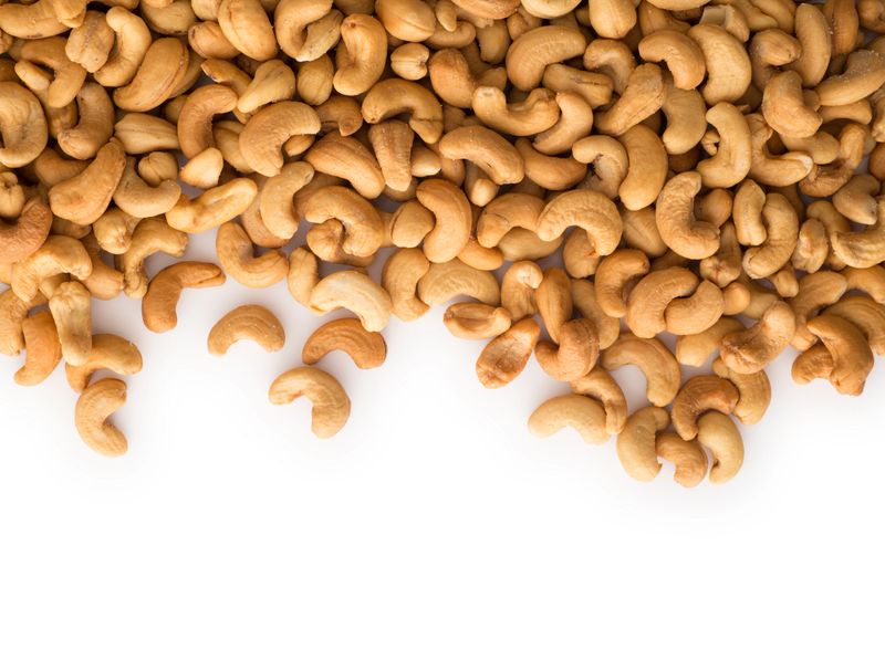 Cashews with copy space , isolated on white