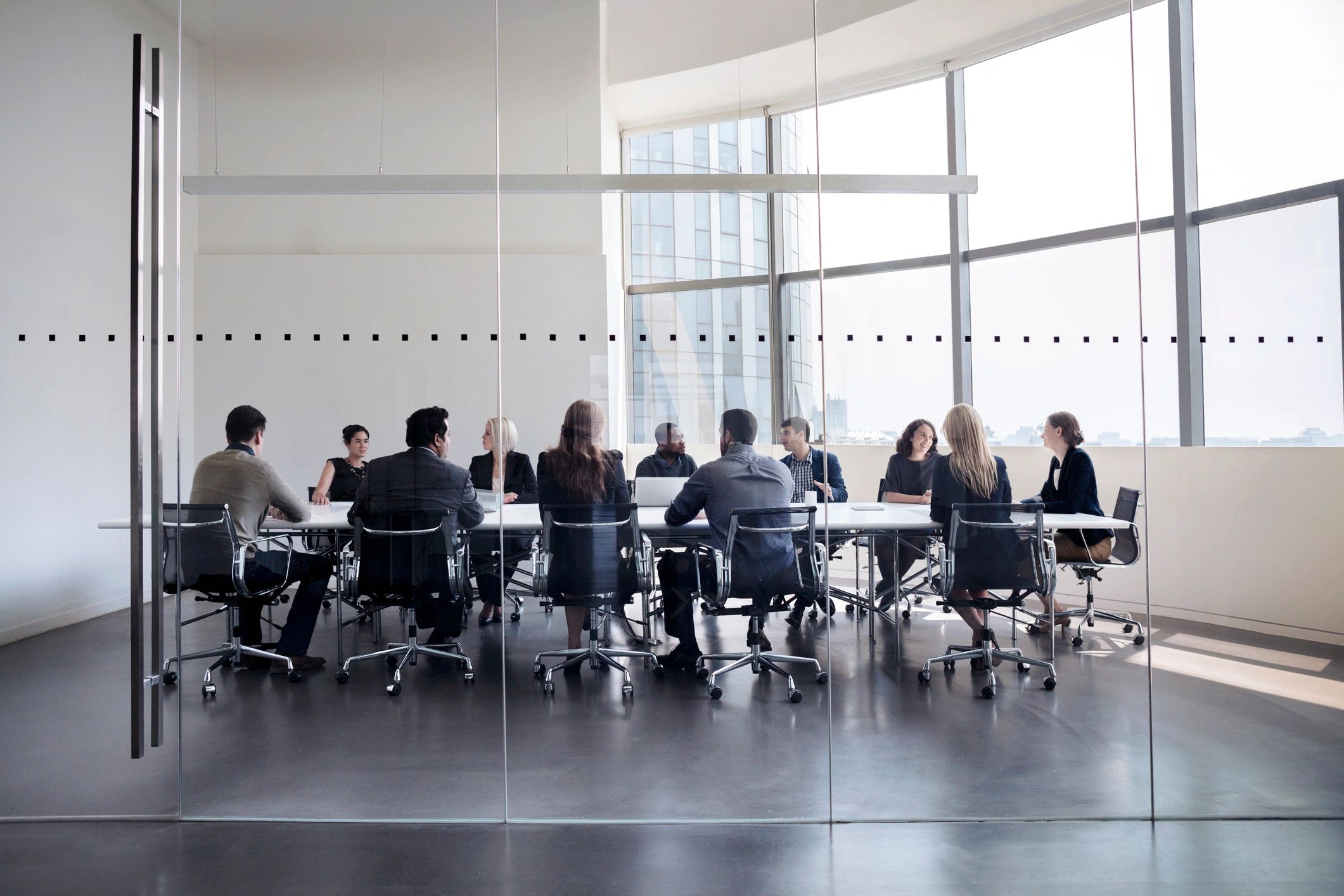 A boardroom with people having a meeting