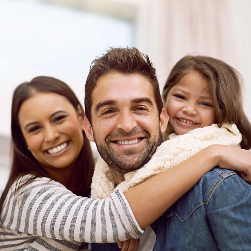 Portrait of a happy family spending quality time together at home