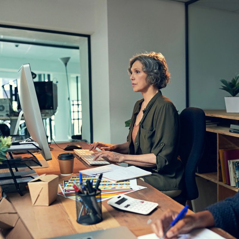Cropped shot of a mature businesswomen working on a computer in an office