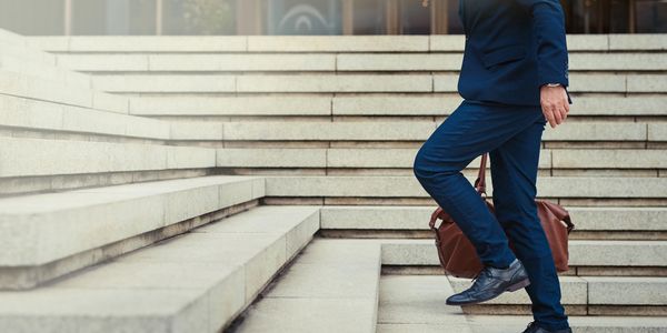 HR professional walking up steps symbolizing growth in Des Moines market