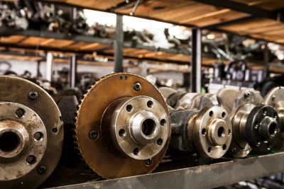 Close-up of mechanical gears on a shelf.