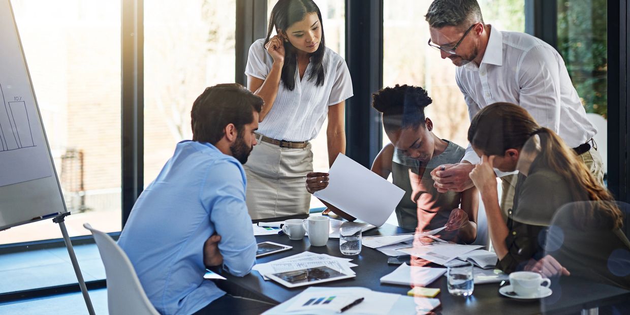 Team collaborating around a conference table.