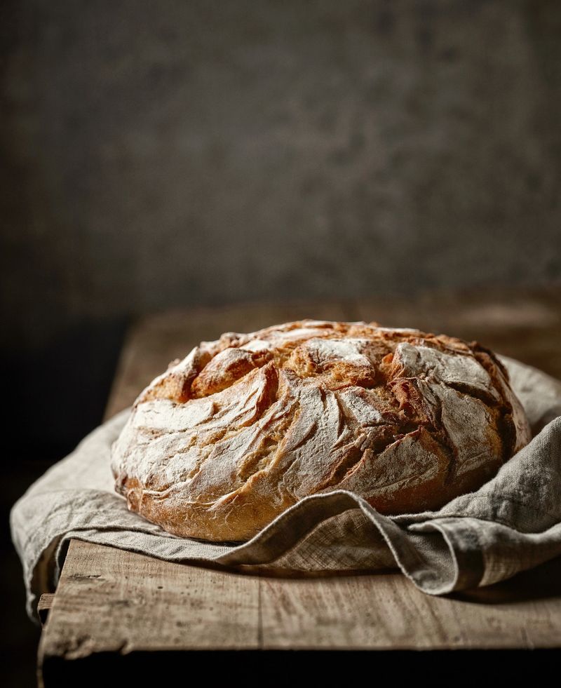 freshly baked bread on rustic wooden table