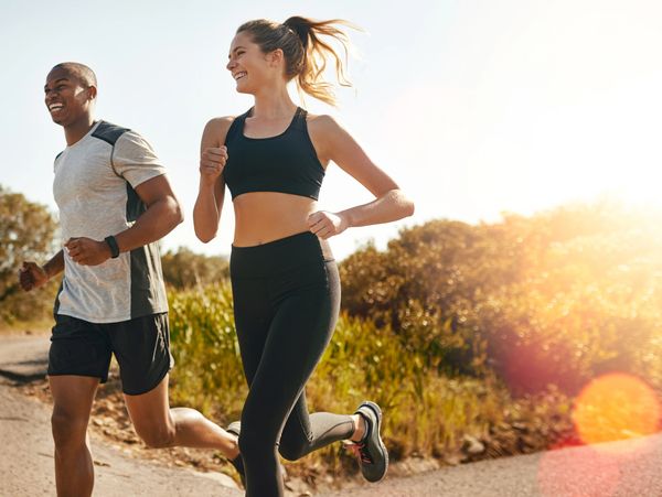 A man and woman running, staying fit because they are using Bioidentical Hormones.