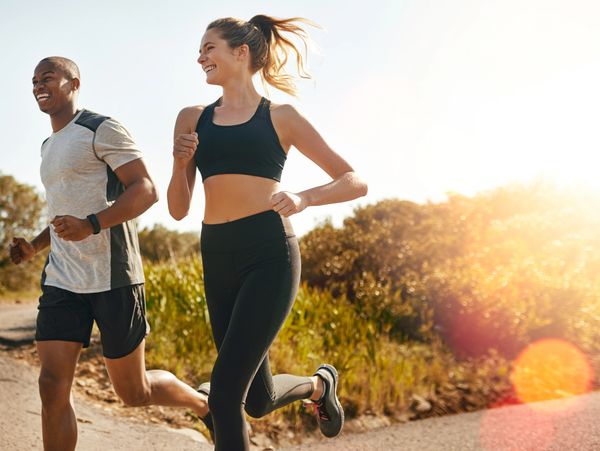 A man and woman running, staying fit because they are using Bioidentical Hormones.