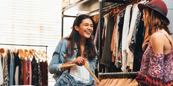 Happy shoppers exploring diverse stores.