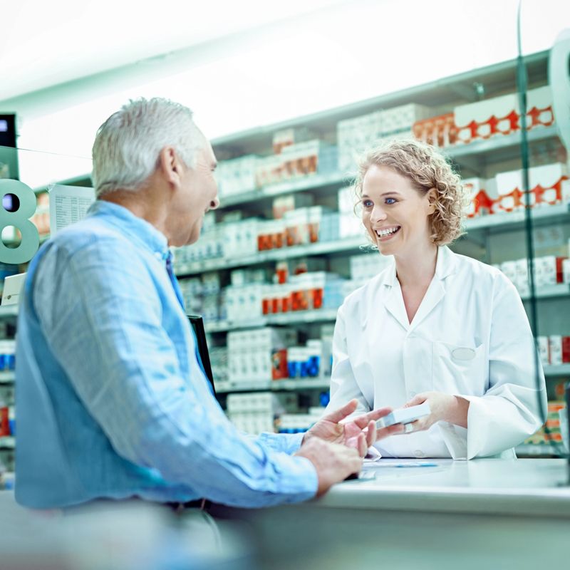 Shot of a female pharmacist assisting a senior customer