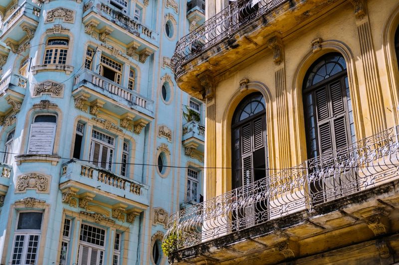 Architecture of old and colourful Havana, Cuba. Balconies on building in rough shape after years of neglect and lack of renovation.