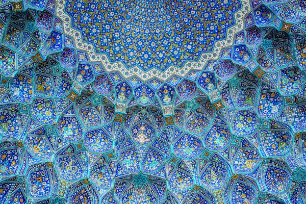 Intricate blue mosaic ceiling with geometric patterns.
