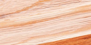 Close-up of light wood grain texture with natural lines.