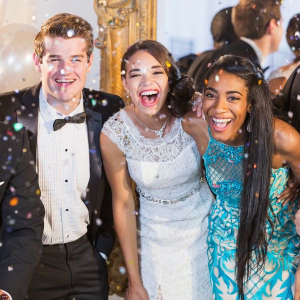 Group of friends celebrating with confetti.