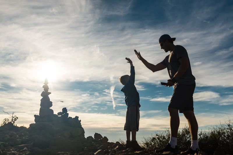Dad And Son At Top Of Their Hike Celebrating