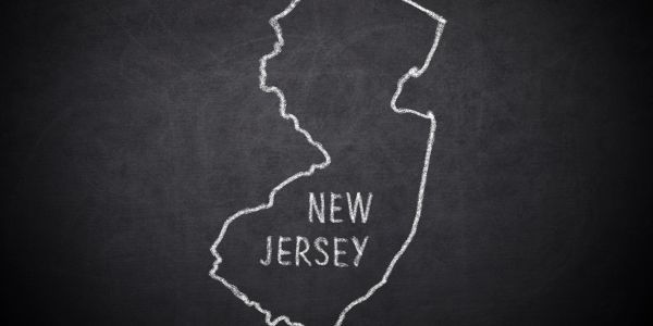 Chalk outline of New Jersey on a blackboard.