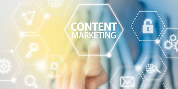 Person pointing at digital content marketing interface with various icons.