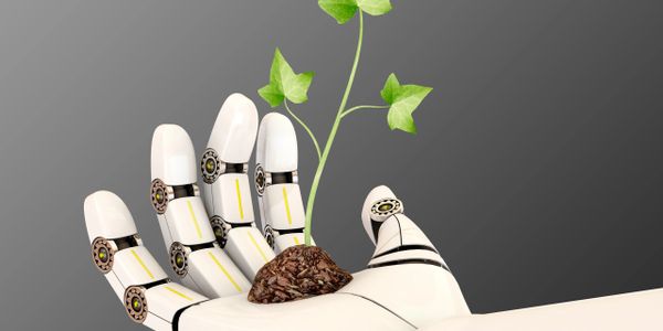 A robotic hand holding soil with a growing green plant.