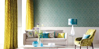 Elegant living room with yellow curtains and blue accents.