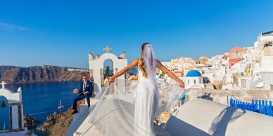 A bride and groom is giving the pose.
