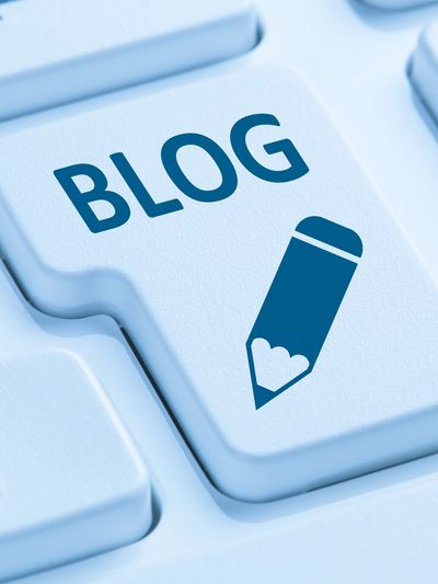 Keyboard key labeled BLOG with a pencil icon symbolizing writing.