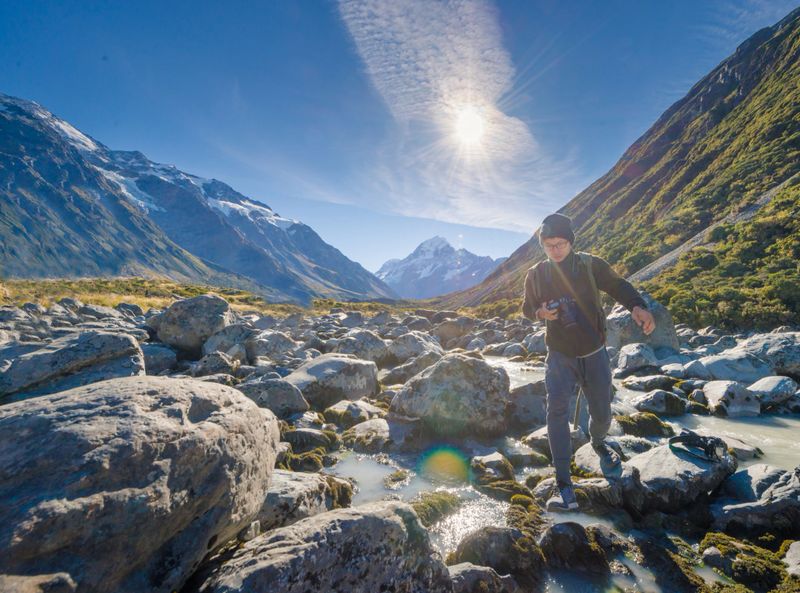Young travler taking photo at queen town  in new zealand