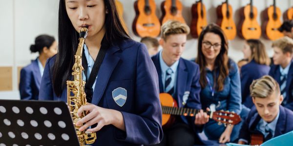 Students practicing music in a classroom.