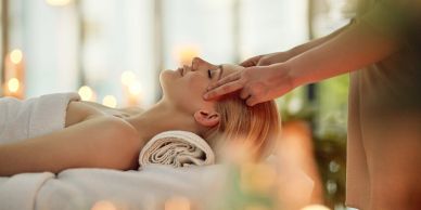 Woman receiving a head massage in a spa.