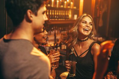 friends drinking at bar