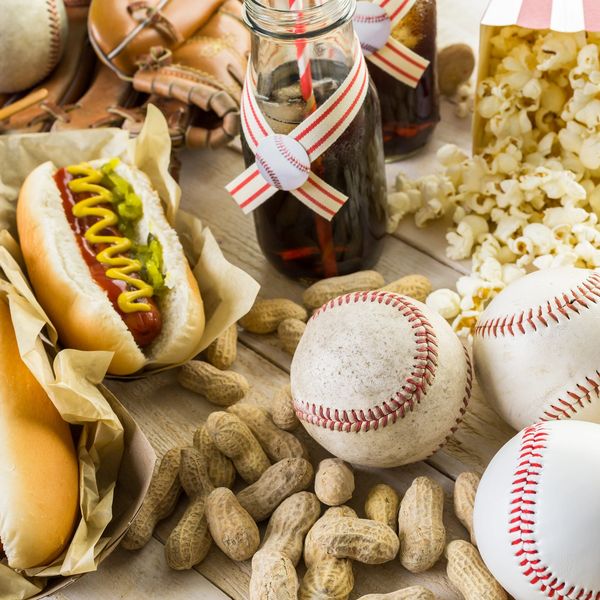 Baseball-themed snacks and items including hot dogs, peanuts, popcorn, and baseballs.
