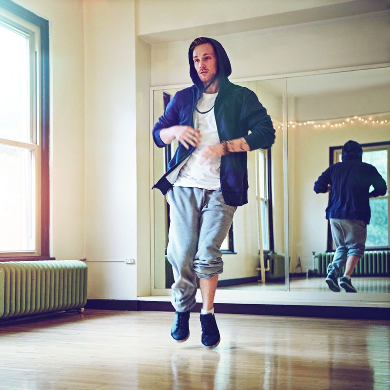 Shot of a young man breakdancing in a studio