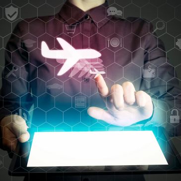 Person interacting with a digital airplane icon above a tablet.