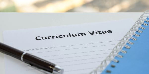 CV on desk with pen and notebook