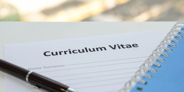 CV on desk with pen and notebook