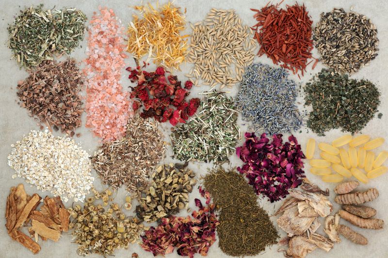 Ingredients to heal skin disorders including herbs, flowers and dietary supplements on hemp paper background  Can help soothe psoriasis and eczema.