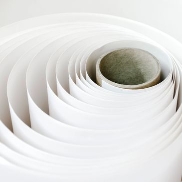 A reel of paper before being put into the printer art paper, photo paper, canvas