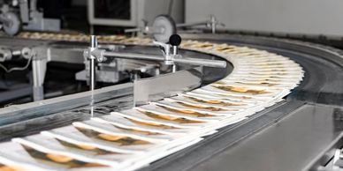 Picture of magazines coming off a printing press.