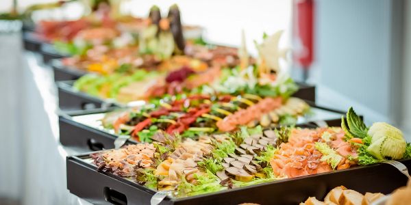 Elegant buffet with assorted appetizers and garnishes.