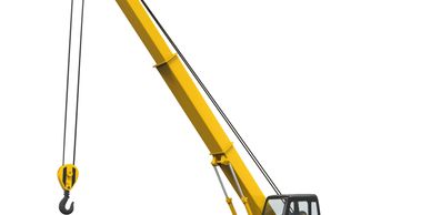 Yellow crawler crane with extended boom and hook isolated on white.