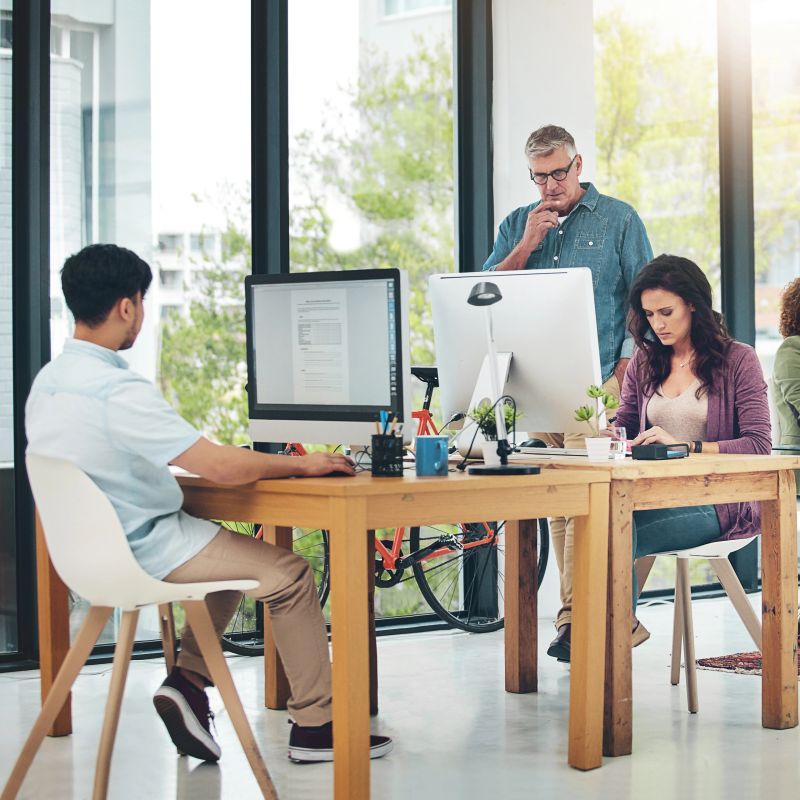 Shot of group of creative colleagues working on a project together in their office