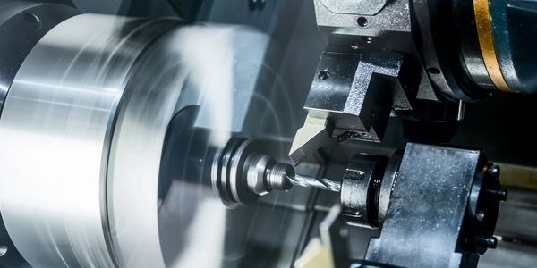 Drilling operation on a CNC lathe. Drill is creating a hole in the center of a hydraulic rod.