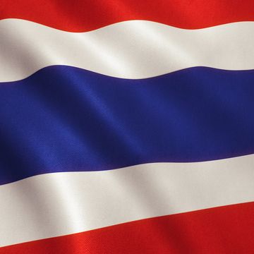 Waving flag with horizontal red, white, and blue stripes.