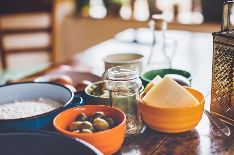 Ingredients of pizza on the old wooden table
