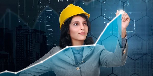 Woman in a yellow helmet drawing an upward graph line.