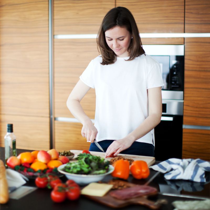 Woman cooking at the kitchen