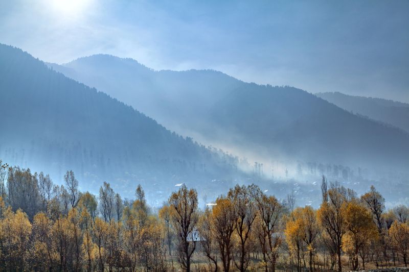 Fog covers a village at the foothills of Himalayan Mountains near Sonmarg, Jammu and Kashmir, India