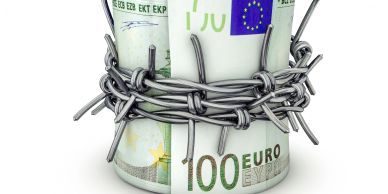 A rolled 100 euro bill wrapped tightly with barbed wire.