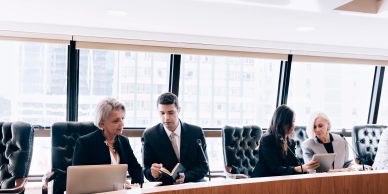 Business professionals engaged in a meeting in a modern office.