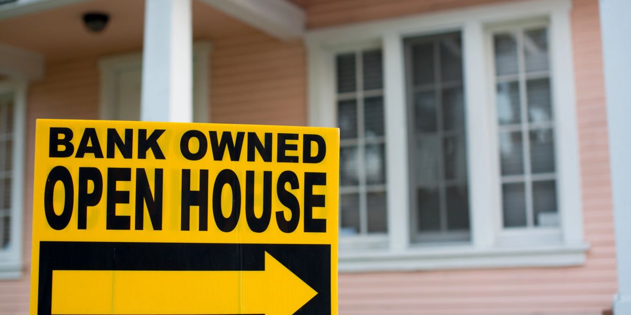 Bank owned open house sign with an arrow.