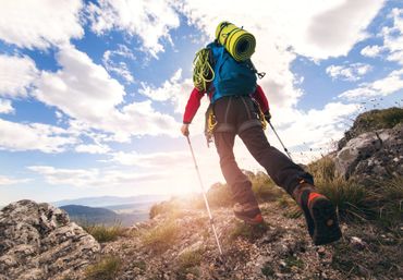 Mountain climber hiking on a trail