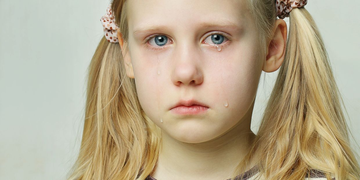 a vulnerable child crying for help