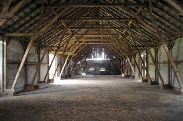 Stock photo interior view of a pole shed with wood frames
